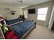 Comfortable bedroom featuring two beds, a TV, and a large window for natural light at 3713 Coach Lantern Ave Ave, Wake Forest, NC 27587