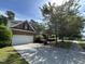 Charming two-story brick home featuring an attached garage and a well-maintained landscaped front yard at 3713 Coach Lantern Ave Ave, Wake Forest, NC 27587