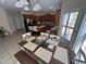 Bright eat-in kitchen area with a wooden dining table and chairs near the gourmet kitchen with modern appliances at 3713 Coach Lantern Ave Ave, Wake Forest, NC 27587