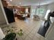 Spacious kitchen showcasing an island, stainless steel appliances, and a dining area with plantation shutters at 3713 Coach Lantern Ave Ave, Wake Forest, NC 27587