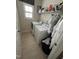 Functional laundry room featuring a side-by-side washer and dryer and storage shelves for added convenience at 3713 Coach Lantern Ave Ave, Wake Forest, NC 27587