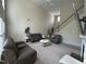 Open-plan living room boasts high ceilings and neutral decor with a cozy fireplace at 3713 Coach Lantern Ave Ave, Wake Forest, NC 27587