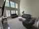 Spacious living room with a fireplace, large windows, and neutral-toned couches with high ceilings at 3713 Coach Lantern Ave Ave, Wake Forest, NC 27587