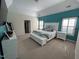 Spacious main bedroom with teal wall, white furniture, and sitting area with bench at 3713 Coach Lantern Ave Ave, Wake Forest, NC 27587