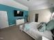 Comfortable main bedroom with accent wall, mounted TV and ensuite access at 3713 Coach Lantern Ave Ave, Wake Forest, NC 27587