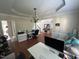 Well-lit office space featuring a chandelier, hardwood floors, and ample workspace at 3713 Coach Lantern Ave Ave, Wake Forest, NC 27587