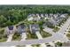 Aerial view of a residential area with well-maintained homes, landscaping, and a community pond at 437 Henmore Brook Dr Dr, Cary, NC 27519