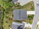 An aerial view of a home with a well-maintained lawn and landscaping, situated near a pond at 437 Henmore Brook Dr Dr, Cary, NC 27519