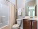 Bathroom featuring a shower, toilet, vanity with sink, towel and a mirror at 437 Henmore Brook Dr Dr, Cary, NC 27519