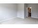 Empty bedroom with neutral paint, carpet, and an open door to the bathroom at 437 Henmore Brook Dr Dr, Cary, NC 27519