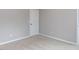 Neutral bedroom featuring a closed door, with carpet flooring at 437 Henmore Brook Dr Dr, Cary, NC 27519