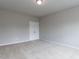 Bedroom with neutral walls and carpeting, with a double-door closet at 437 Henmore Brook Dr Dr, Cary, NC 27519