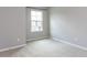 A bright bedroom featuring neutral walls and carpet with a single window at 437 Henmore Brook Dr Dr, Cary, NC 27519