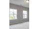 Spacious bedroom with two large windows letting in plenty of natural light at 437 Henmore Brook Dr Dr, Cary, NC 27519