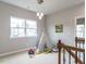 Bonus room featuring a play teepee and neighborhood views from the large window at 437 Henmore Brook Dr Dr, Cary, NC 27519
