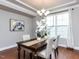Traditional dining room featuring hardwood floors and classic chandelier at 437 Henmore Brook Dr Dr, Cary, NC 27519