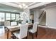 Traditional dining room with hardwood floors adjacent to the home's staircase at 437 Henmore Brook Dr Dr, Cary, NC 27519