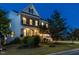 Charming two-story home featuring a combination of brick and siding, a welcoming front porch, and mature landscaping at 437 Henmore Brook Dr Dr, Cary, NC 27519