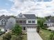 Beautiful two-story home with brick and siding, two-car garage, and well-maintained lawn offering stunning curb appeal at 437 Henmore Brook Dr Dr, Cary, NC 27519