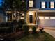 Beautiful home with a brick facade, covered entrance, two-car garage, and lush landscaping offering stunning curb appeal at 437 Henmore Brook Dr Dr, Cary, NC 27519