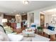 Open-concept living room showcasing hardwood floors, fireplace, and open flow to the kitchen at 437 Henmore Brook Dr Dr, Cary, NC 27519