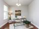Bright home office with hardwood floors, neutral paint, large window, and a stylish desk at 437 Henmore Brook Dr Dr, Cary, NC 27519