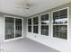 Covered patio with sliding glass doors and several windows offering plenty of natural light at 437 Henmore Brook Dr Dr, Cary, NC 27519
