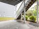 Concrete patio under wooden stairs overlooking the landscaped backyard and the yard at 437 Henmore Brook Dr Dr, Cary, NC 27519