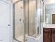 A bright bathroom featuring a shower with glass enclosure at 437 Henmore Brook Dr Dr, Cary, NC 27519