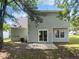 View of the backyard featuring a concrete patio and view of the back of the house at 4509 Cobble Creek Ln, Raleigh, NC 27616