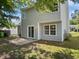 The property features a backyard with a patio, and a well-maintained lawn, perfect for outdoor living at 4509 Cobble Creek Ln, Raleigh, NC 27616