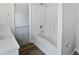 Bathroom featuring a shower-tub combo, white vanity, and modern fixtures at 4509 Cobble Creek Ln, Raleigh, NC 27616