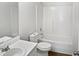 Clean bathroom featuring a shower over bath and single sink at 4509 Cobble Creek Ln, Raleigh, NC 27616