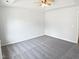Bright bedroom featuring a tray ceiling, neutral carpet, and fresh, neutral paint at 4509 Cobble Creek Ln, Raleigh, NC 27616