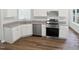 Modern kitchen with stainless steel appliances, granite countertops, and ample cabinet space at 4509 Cobble Creek Ln, Raleigh, NC 27616