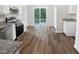 Open kitchen features modern stainless steel appliances and a seamless flow to the backyard at 4509 Cobble Creek Ln, Raleigh, NC 27616