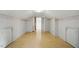 Finished attic area with laminate flooring, white walls, and ample storage space at 4600 Smithfield Rd, Wendell, NC 27591