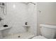 This bathroom features a tiled shower with built in seats and a toilet at 4600 Smithfield Rd, Wendell, NC 27591