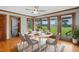 Dining area with a large window, ceiling fan, and six chairs around a table at 4600 Smithfield Rd, Wendell, NC 27591