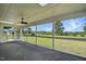Covered screened porch featuring outdoor views, and an attached staircase at 4600 Smithfield Rd, Wendell, NC 27591