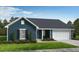 Charming single-story home with a welcoming porch, manicured lawn, and attached two-car garage at 49 Brodhead Dr, Fuquay Varina, NC 27526