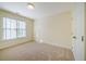 Bright bedroom features neutral walls, carpeted floors and a sunny window at 507 Vatersay Dr, Apex, NC 27502