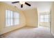 Spacious carpeted bedroom with large windows allowing for natural light at 507 Vatersay Dr, Apex, NC 27502