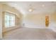 A versatile bonus room with built-in shelves, neutral carpet and ample natural light at 507 Vatersay Dr, Apex, NC 27502