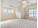 A versatile bonus room with built-in shelves, neutral carpet and ample natural light at 507 Vatersay Dr, Apex, NC 27502