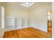 Dining room featuring built-in shelving, hardwood floors, and a coffered ceiling at 507 Vatersay Dr, Apex, NC 27502