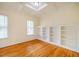 Dining room featuring built-in shelving, hardwood floors, and a coffered ceiling at 507 Vatersay Dr, Apex, NC 27502