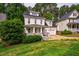 Landscaped front yard view of home with a welcoming front porch and attached garage at 507 Vatersay Dr, Apex, NC 27502