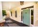 Covered front porch featuring wood decking and a light blue door with a unique door knocker at 507 Vatersay Dr, Apex, NC 27502