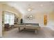 Large game room featuring a pool table, built-in shelves, and neutral colored carpet at 507 Vatersay Dr, Apex, NC 27502